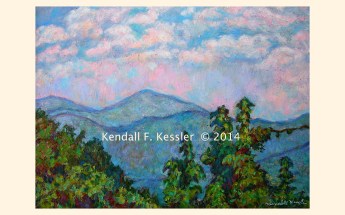 Green trees in front of blue mountains snd pink and white clouds in sky