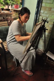 Woman working at an easel