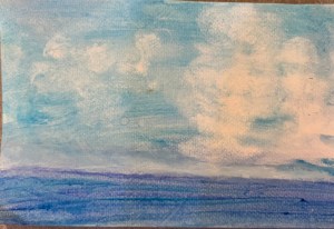 Clouds over blue water